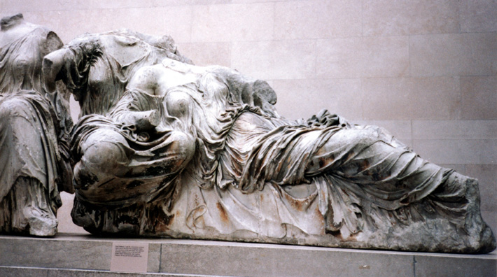 ELGIN MARBLES: We departed Hever castle for London in such high spirits (and time-shifted confusion) that we left two of our number there by mistake and had to go back and fetch them; so we had plenty of time to examine the delights of the English countryside and contrast it to modern London as we threaded our way through its streets to our hotel, St. Margaret's, a few minute's walk from the British Museum and our next morning's destination, where we viewed the sculptures Lord Elgin took from the Parthenon. This group of women well illustrates the wet t-shirt look perfected by the classical Greeks, who contrived to reveal the body as much clothed as unclothed.