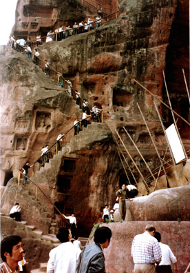 LESHAN: Tourists labor up the winding trail to the top.