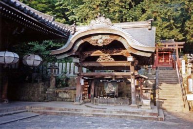 NARA: Part of the Todai-ji Temple complex. This is The temple fountain. In this building, closed to the public, is a famous eleven-faced image of Kannon, Bodhisattva of mercy. The original structure was built in 752, but the present building dates from 1669, after the original burned. It is the site of an annual very popular water festival: Omizu-tori. May 21, 1998
