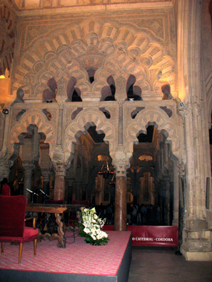 CORDOBA: A wall of more ornately sculpted marble arches.