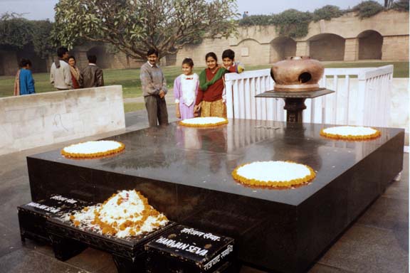 This simple slab marks the spot where Mahatma Gandhi was cremated. It is decorated simply with flower petals. The donation boxes in the foreground accept donations to aid Gandhi's beloved Untouchables, whom he called "harijans", "Children of God."