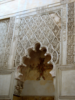 CORDOBA: This tiny Jewish synagogue, built in 1316, is the best preserved in Spain. The details of its ornamentation display Moorish influence. Note the Christian cross placed inside the niche. It was its conversion into a Christian chapel that saved this synagogue from destruction.