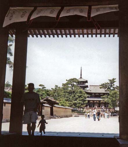 NARA: May 23: We took a very long bus ride from the city center to the grounds of the Horyuji Temple, a large complex of shrines and other buildings. There is some dispute about how much remains of the original 7th century construction, but much of it is very old. Some of them are among the world’s oldest surviving wooden structures. This is the view from the gateway toward the Kondo (main hall—6th-8th C.).