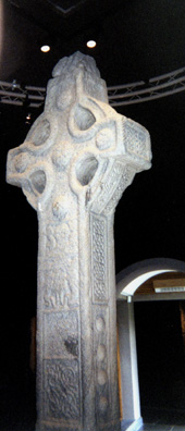 CLONMACNOISE: Clonmacnoise features a number of high crosses, the finest of which have been removed to the safety of the attached museum, with replicas installed outdoors. -opposite sides of the same cross--that's why the designs don't match.