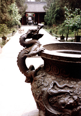 THREE SUS: From the shrine a dragon handle on a pot.