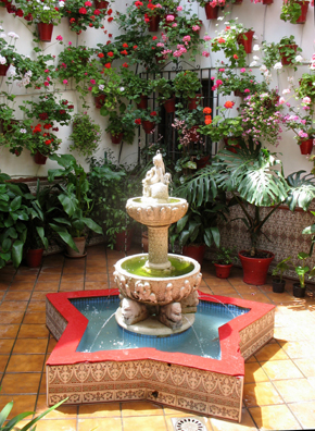 CORDOBA: Note the miniature spitting lions at the base of the fountain, reminiscent of those in the Alhambra.
