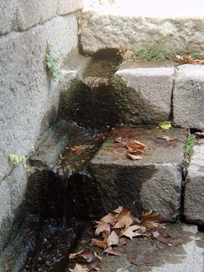 ASCLEPION: The outflow is channelled to trickle down the side of stairs going down to the underground corridor which connects it with the Temple of Telesphorus.