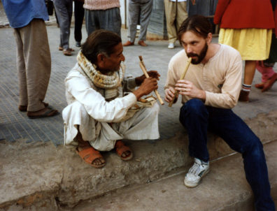 World Music professor Paul Smith and sidewealk flute vendor.