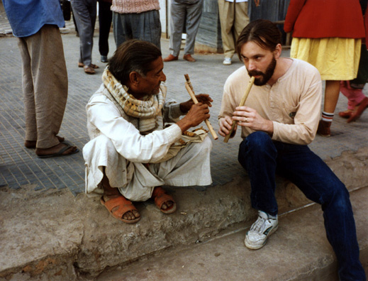 World Music professor Paul Smith and sidewealk flute vendor.