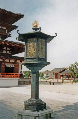 NARA: Replica of a lantern showing flute-playing spirits in front of an unidentified temple. The original is in a museum in Nara. May 21, 1998