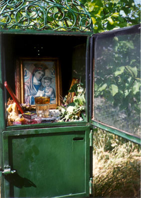 DELPHI: Scattered all along the roads are these shrines memorializing accident victims (usually on dangerous curves). Here a glass of oil has been left burning. We didn't know why the door was open, but it afforded us a chance to take an unusual picture.