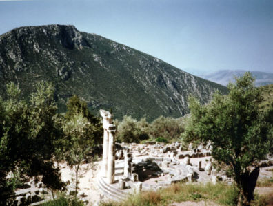DELPHI: The Temenos of Athena includes the three reconstructed pillars of the Tholos, a round 4th-century building whose original function is unknown.