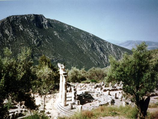 DELPHI: The Temenos of Athena includes the three reconstructed pillars of the Tholos, a round 4th-century building whose original function is unknown.