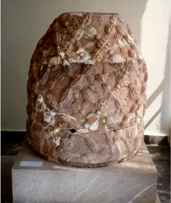 DELPHI: At the entrance to the Delphi museum is this Hellenistic replica of the Omphalos, the navel of the world, which was originally simply a rounded rock draped with woolen strands, an effect here copied by the sculptor in stone. It originally stood in the adyton of the Temple of Apollo, and marked the center of the earth.