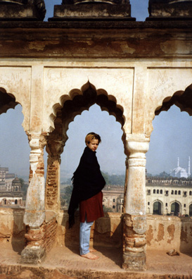 Megan gives a sense of the scale of the arches. In the distance, the roofs of Lucknow.