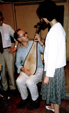 SZECHUAN MUSIC CONSERVATORY: Michael with pipa and erhu. (We had pipa's made of food floating in soup at dinner.)