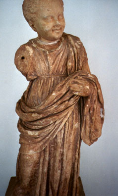 DELPHI: A terracotta decorative Hellenistic sculpture of a child.
