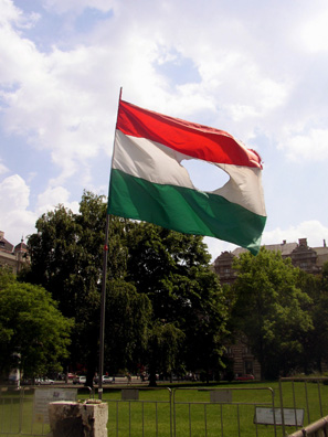 BUDAPEST: This Hungarian flag has a hole in it because on October 23, 1956 the revolutionists, those Hungarian who revolted against the Soviet Union, tore out of it the foreign coat of arms that symbolized the power of the Soviet Union and Communism. Since then this flag has symbolized the freedom of the Hungarian nation.