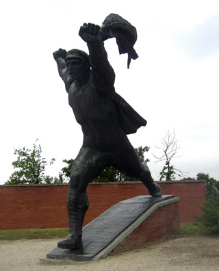 BUDAPEST: A dramatically striding revolutionary waving a flag.