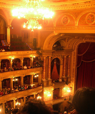 BUDAPEST: View from the cheap seats (some of the action was hidden from us down on stage left.) The interior was just as gorgeous as the opera house in Prague, but the production was far more lavish. Lighting, costumes, and sets reminded us of 19th-century paintings.