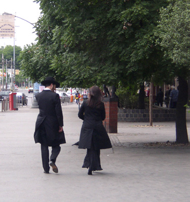 BUDAPEST: Couple in traditional Jewish dress on the Sabbath. Most Hungarian Jews were murdered by the Nazis in the waning months of World War II, but a small community and many foreign visitors sustain what is still the largest synagogue in Europe.