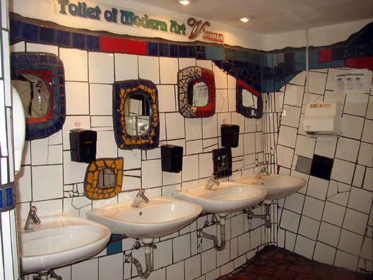 VIENNA: A restroom in the shopping center adjacent to Hundertwasserhaus, designed to match Hundertwasser's quirky architectural style.
