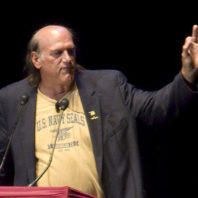 Jesse Ventura speaking behind podium.