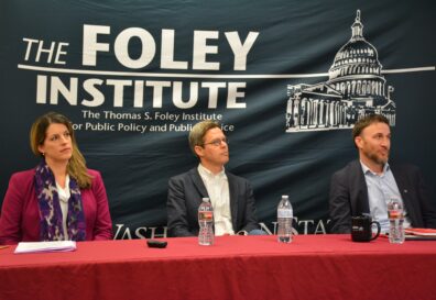 Jennifer Henrichsen, Matthew Powers, and Benjamin Shors at table during panel discussion.  