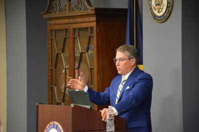 Patrick Deneen speaking at podium. 