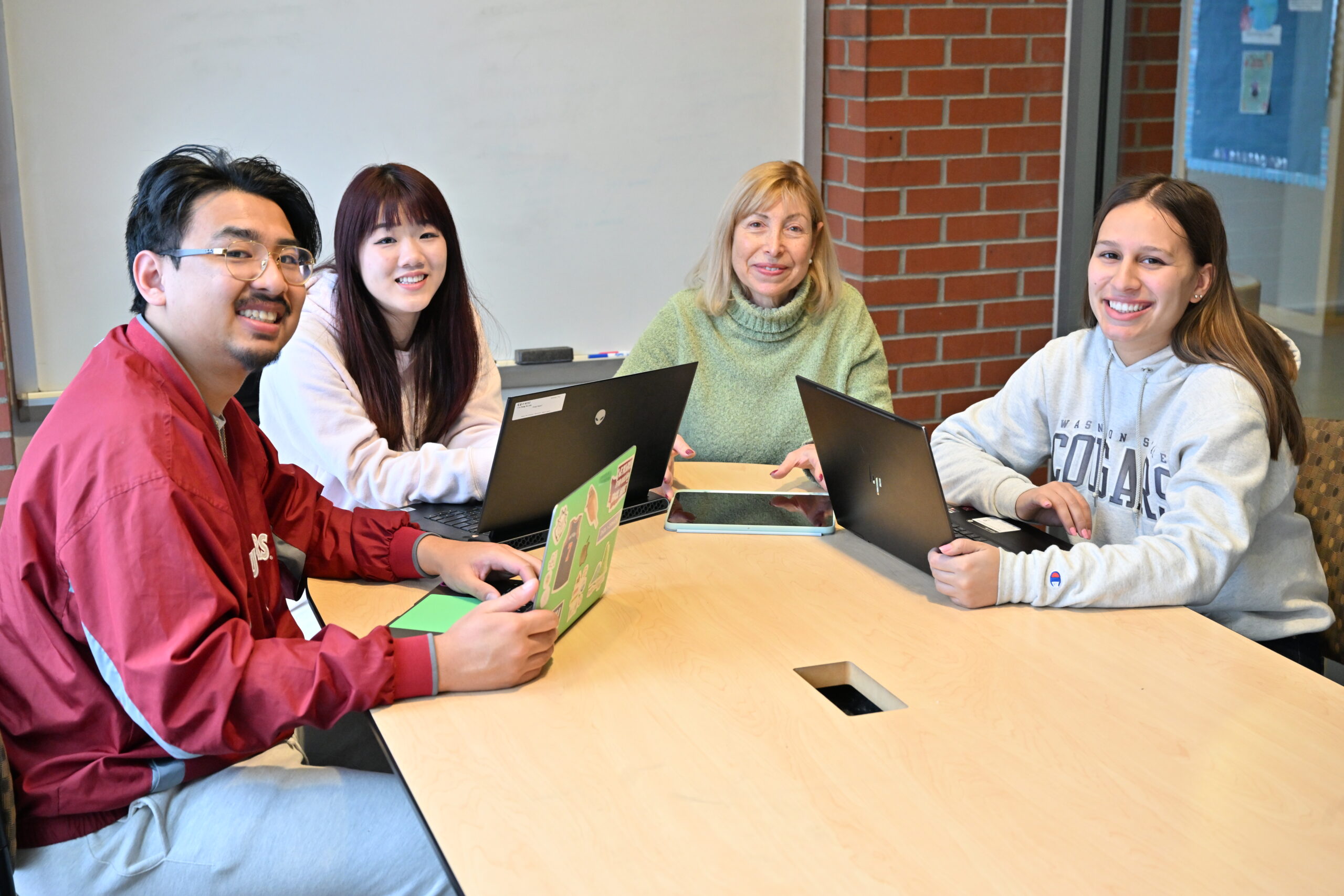 Students sitting with advisor.