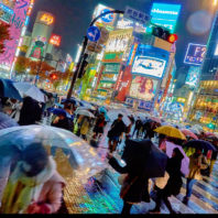 Photo of busy Tokyo street in the rain, by Moyan Brenn