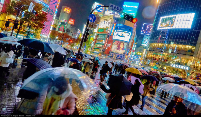 Photo of busy Tokyo street in the rain, by Moyan Brenn