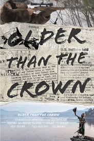 This is a movie poster for the documentary Older Than the Crown. The image has the title written over the top of old newspaper and under that is an image of a member of the Sinixt community standing in front of a lake that marks their ancestral hunting grounds. 