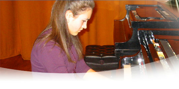 student playing grand piano