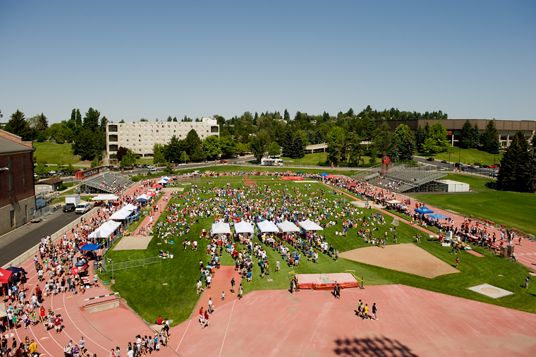 Students having a large picnic on the field