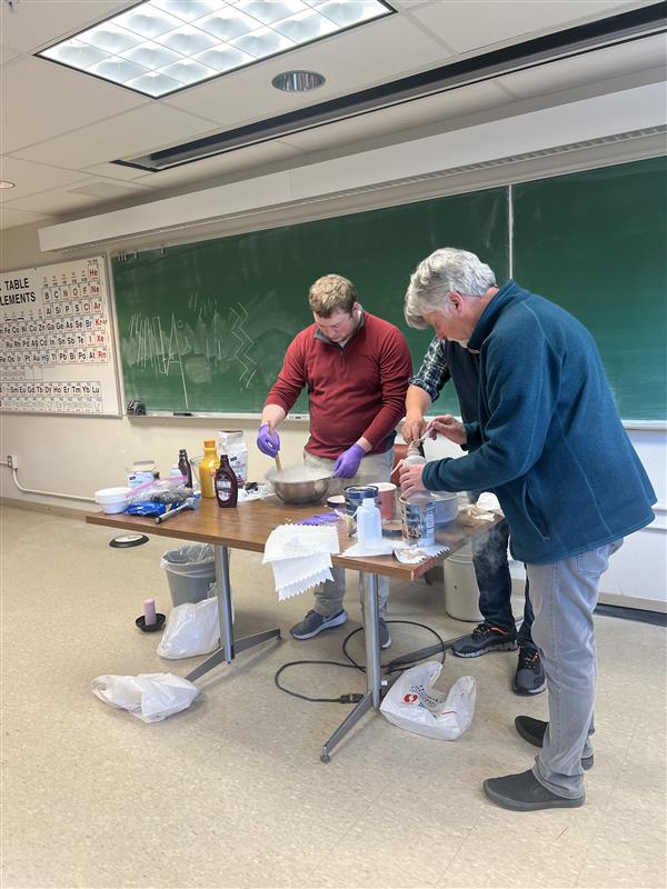 Fisher and Buckley conducting an experiment in the classroom.