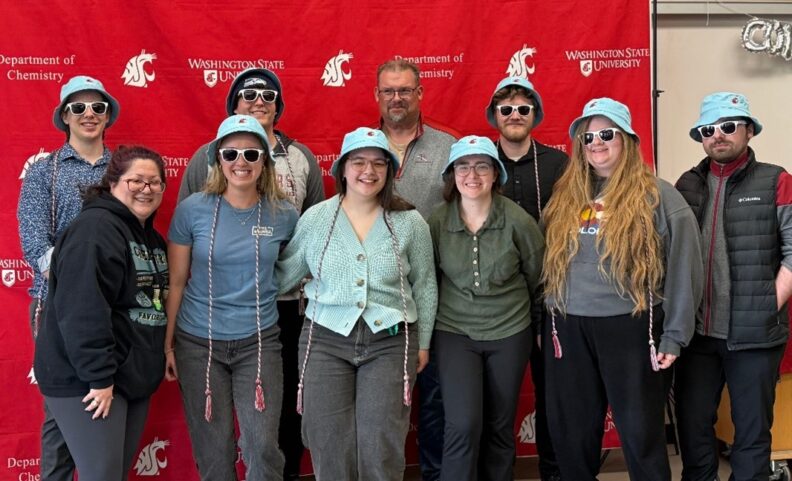 Left to right back row: Aaren Smith, Caleb Rudd, Dr. Lessmann, and Sam Venness; left to right front row: Dr. Nishida, Ashley Weller, Zoe Lemchen, Olena Hoppe, Nina Palmer, and Blake Conrad.
