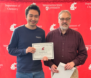 Phong Huynh receiving an award.