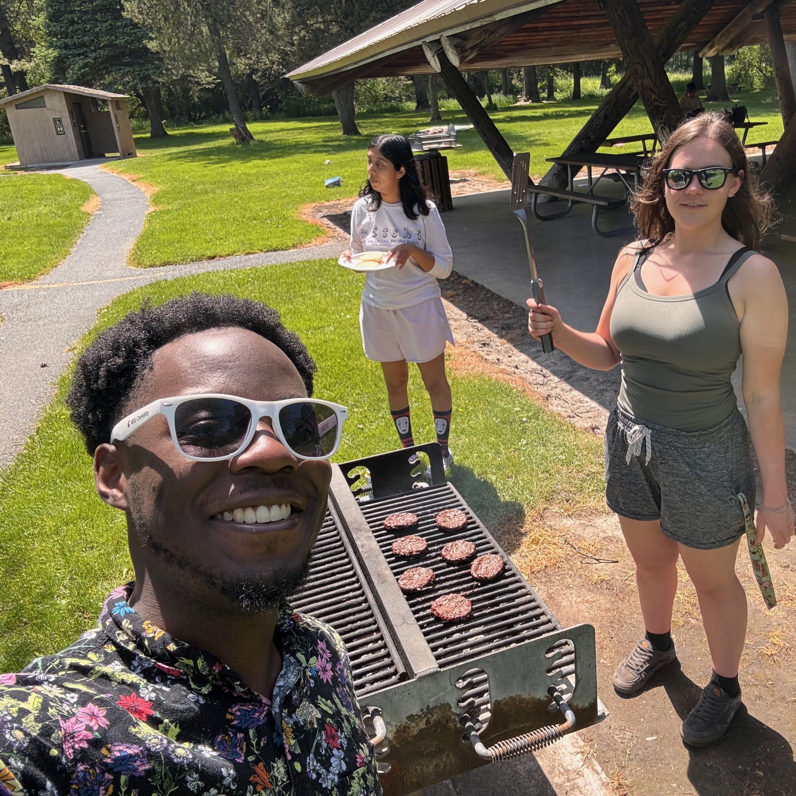 Three students at a BBQ.