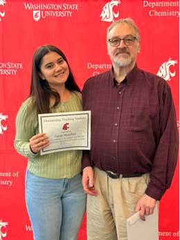 Sarah receiving an award.