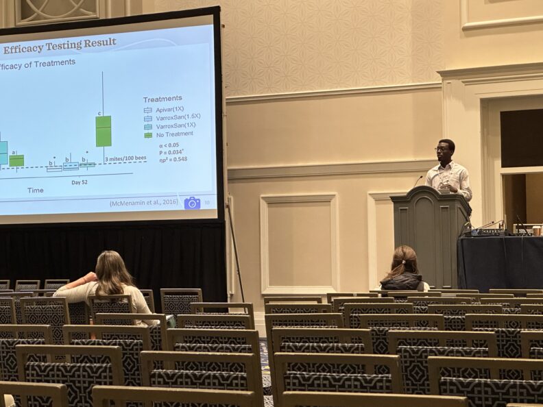 Image of student presenting at conference