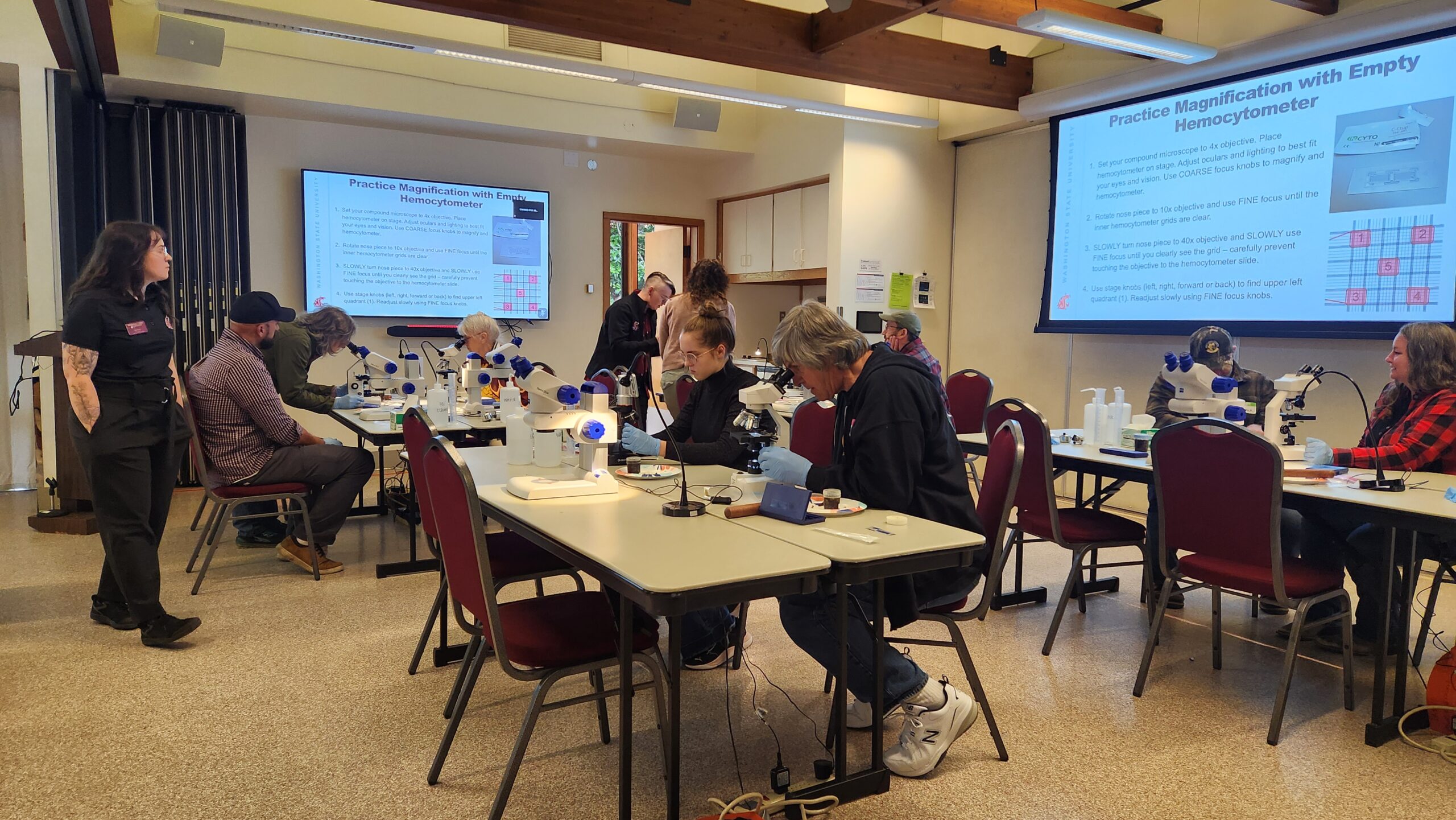 beekeepers working on practicing magnification with empty hemocytometers