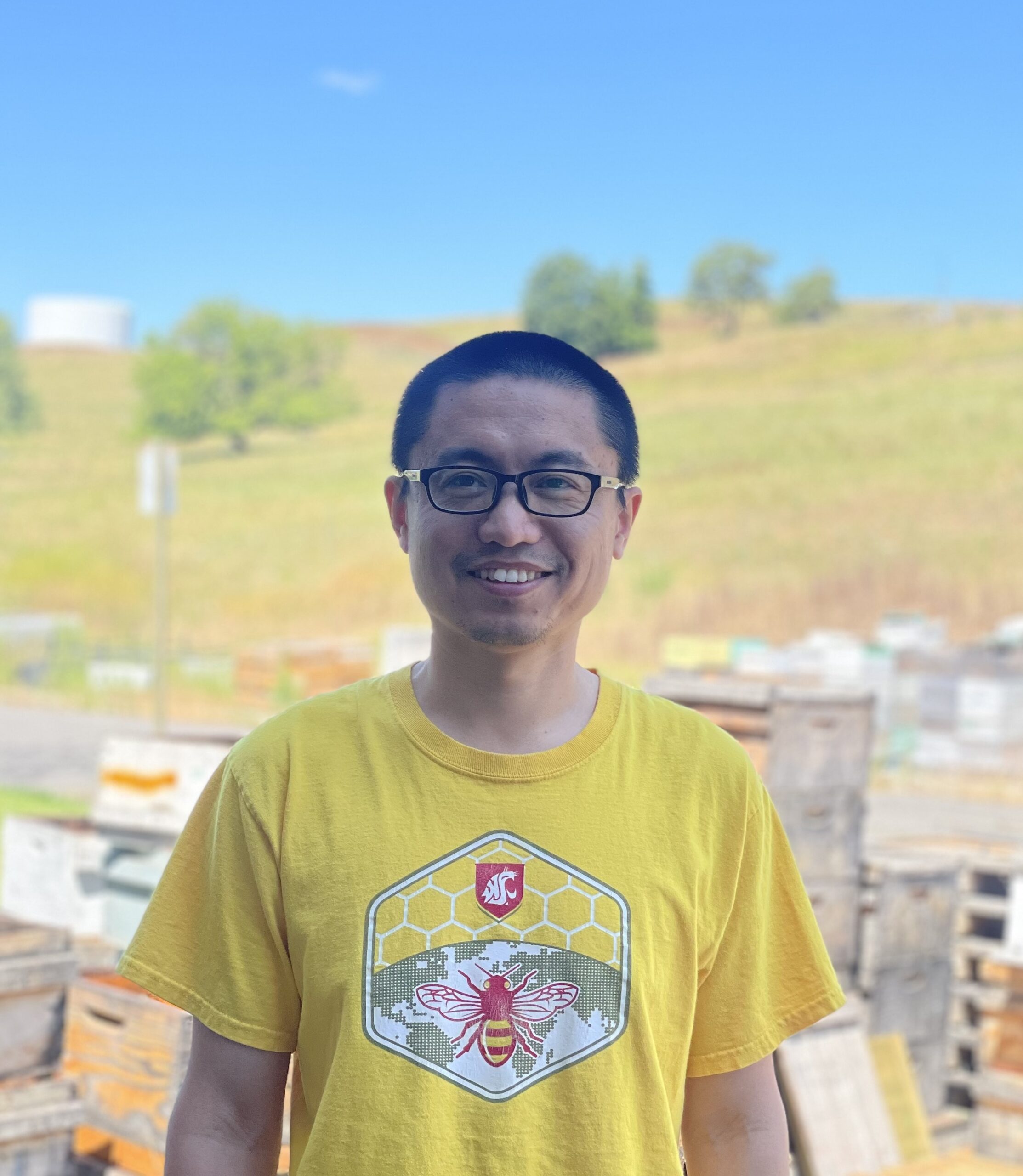 Dr. Ge Zhang wearing yellow WSU Bee program shirt