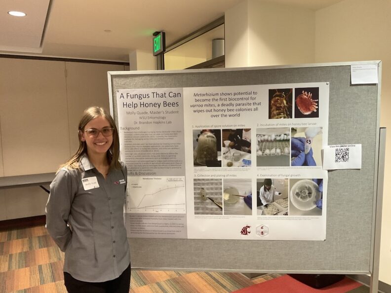 Molly Quade in front of her "A Fungus that Can Help Honey Bees" poster