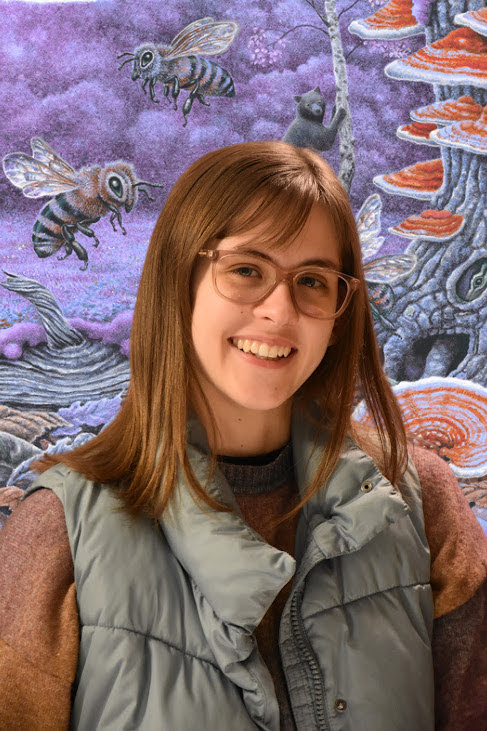 Molly quade with bees and mushrooms behind her