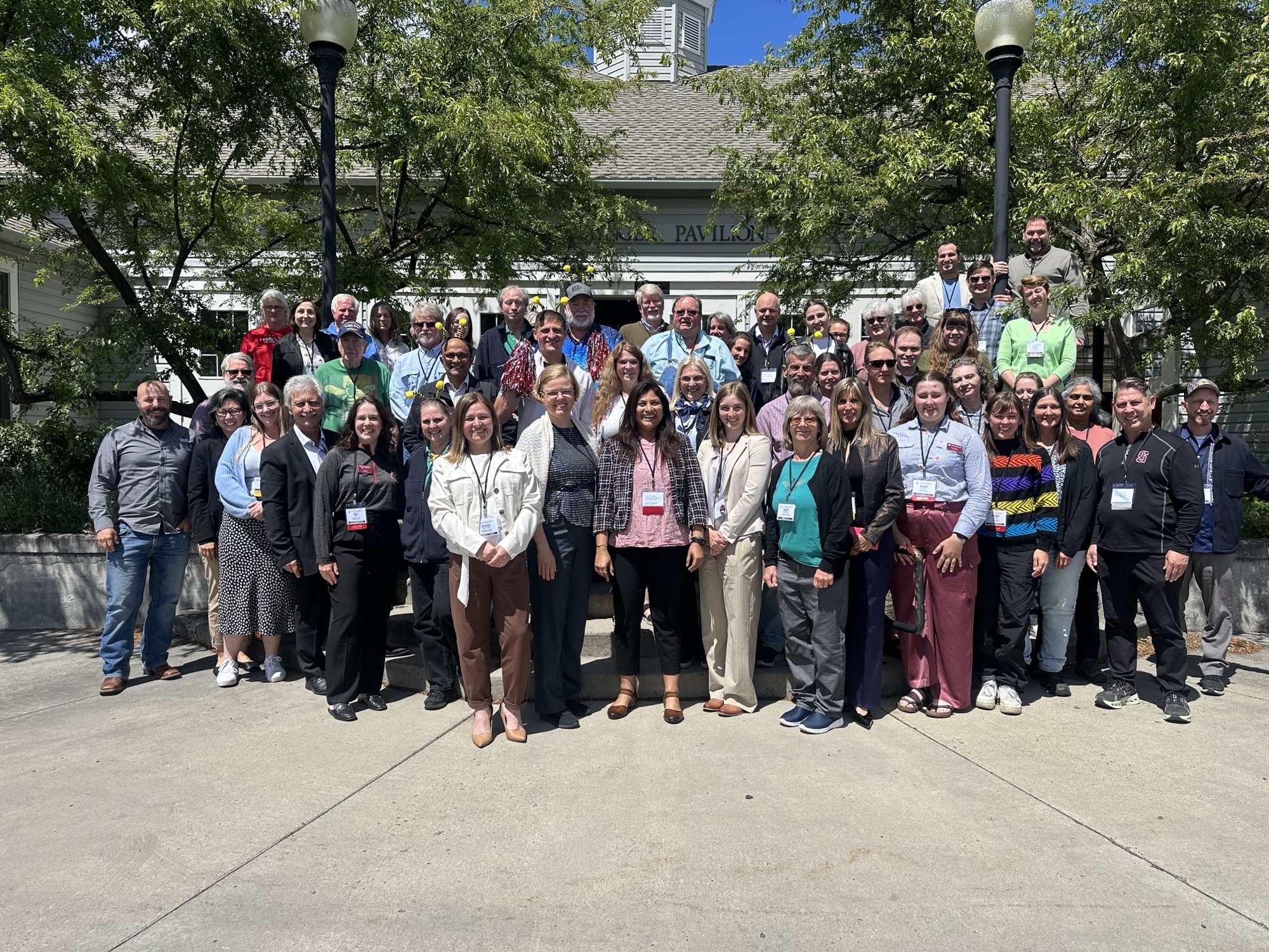Conference attendees and WSU Bee Program team members in front of the Ensminger Pavilion during the 2026 Local COLOSS North America Conference in Pullman, WA (June 6-9, 2026).