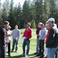 A man presenting to people.