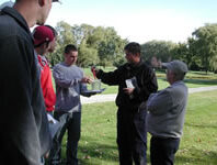 A man speaking to people.