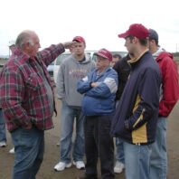 A group of men talking.