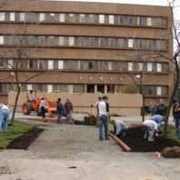 People working on a courtyard.